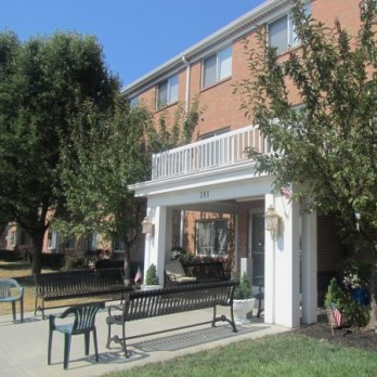 Sherman Glen building exterior entrance with benches