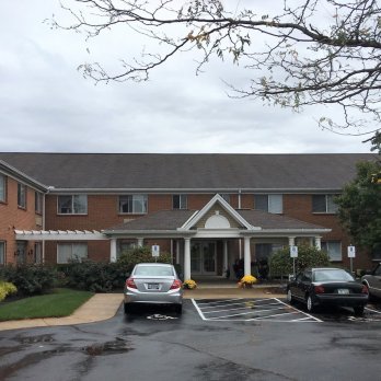 Parking lot view of entrance of Carriage Hill building