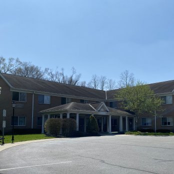 Meadow Crossings building entrance with patio