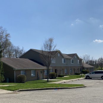 parking lot view of Colony Woods and cars